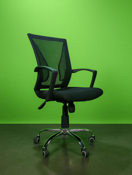 Side view of a black ergonomic mesh office chair with chrome base, adjustable height via 120mm hydraulic system, and a 9.5-inch body tilt mechanism, placed against a solid green background."